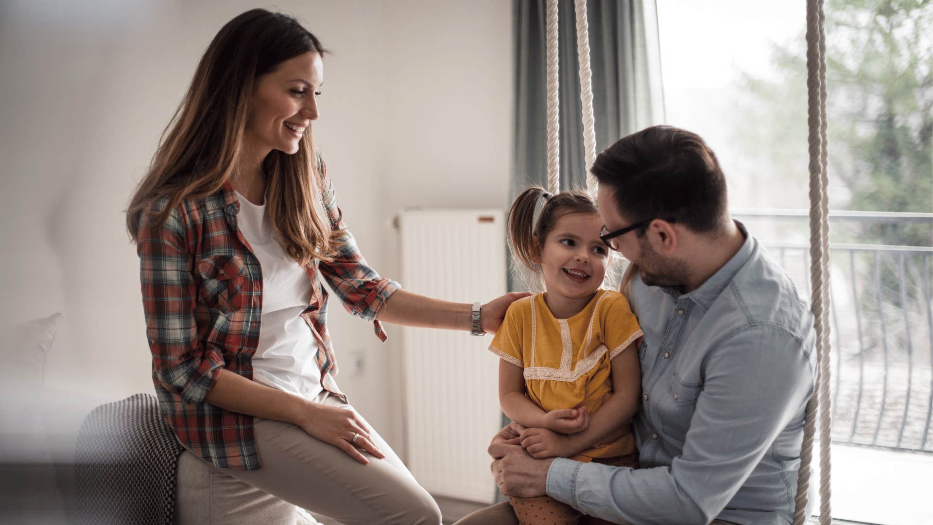 mother and father with child