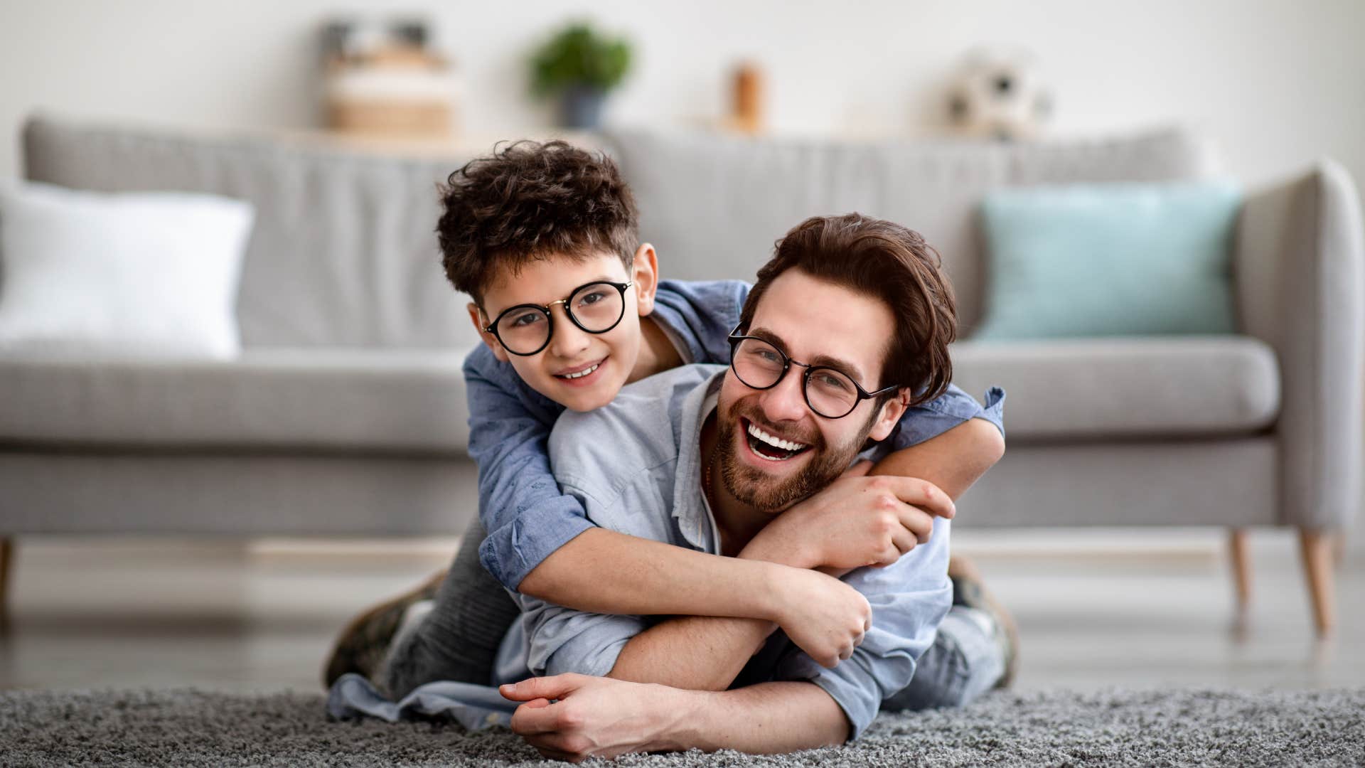 dad and son playing on floor