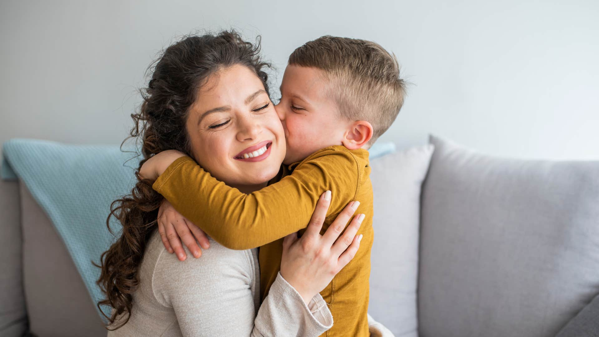 son kissing mom on cheek