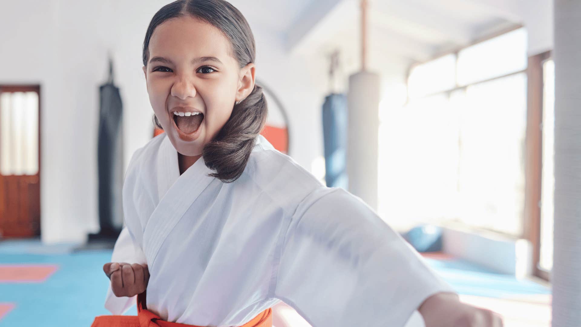 young girl learning karate