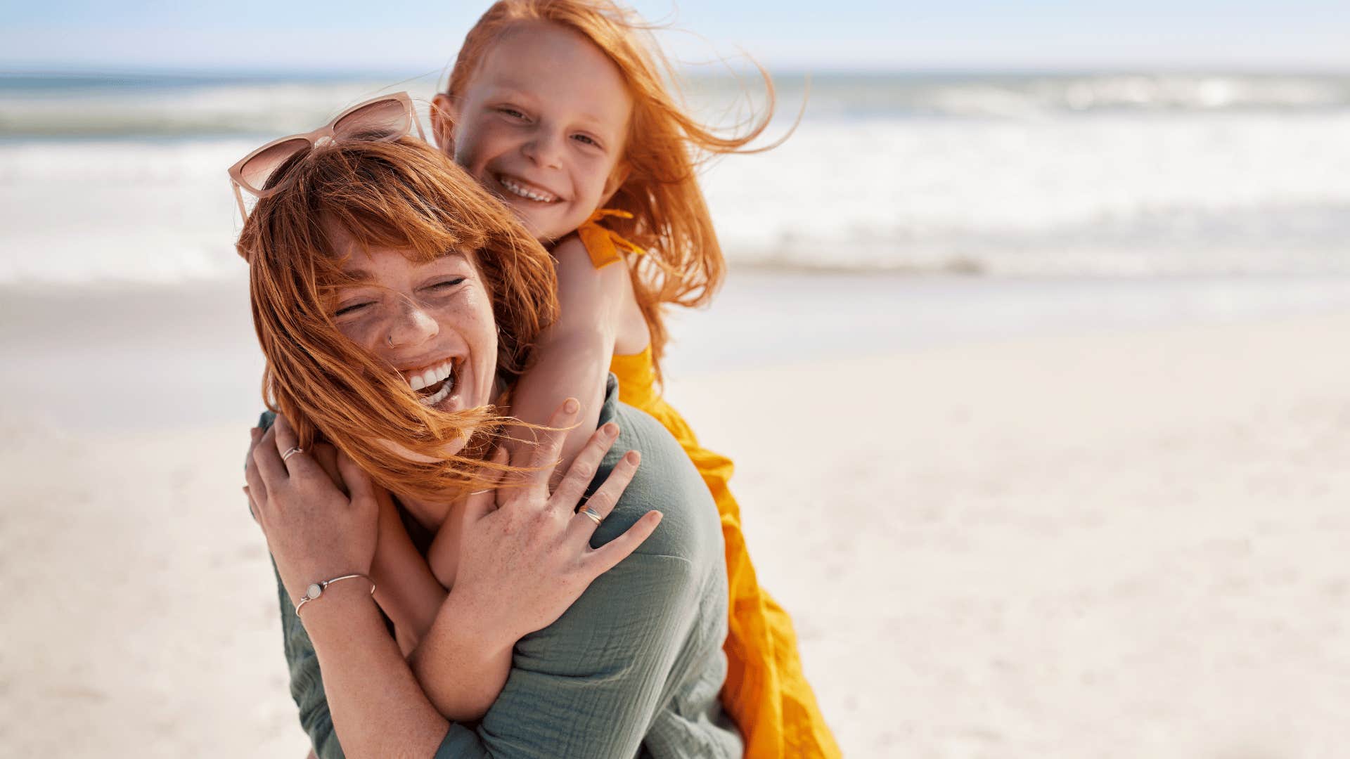 mother with child on beach