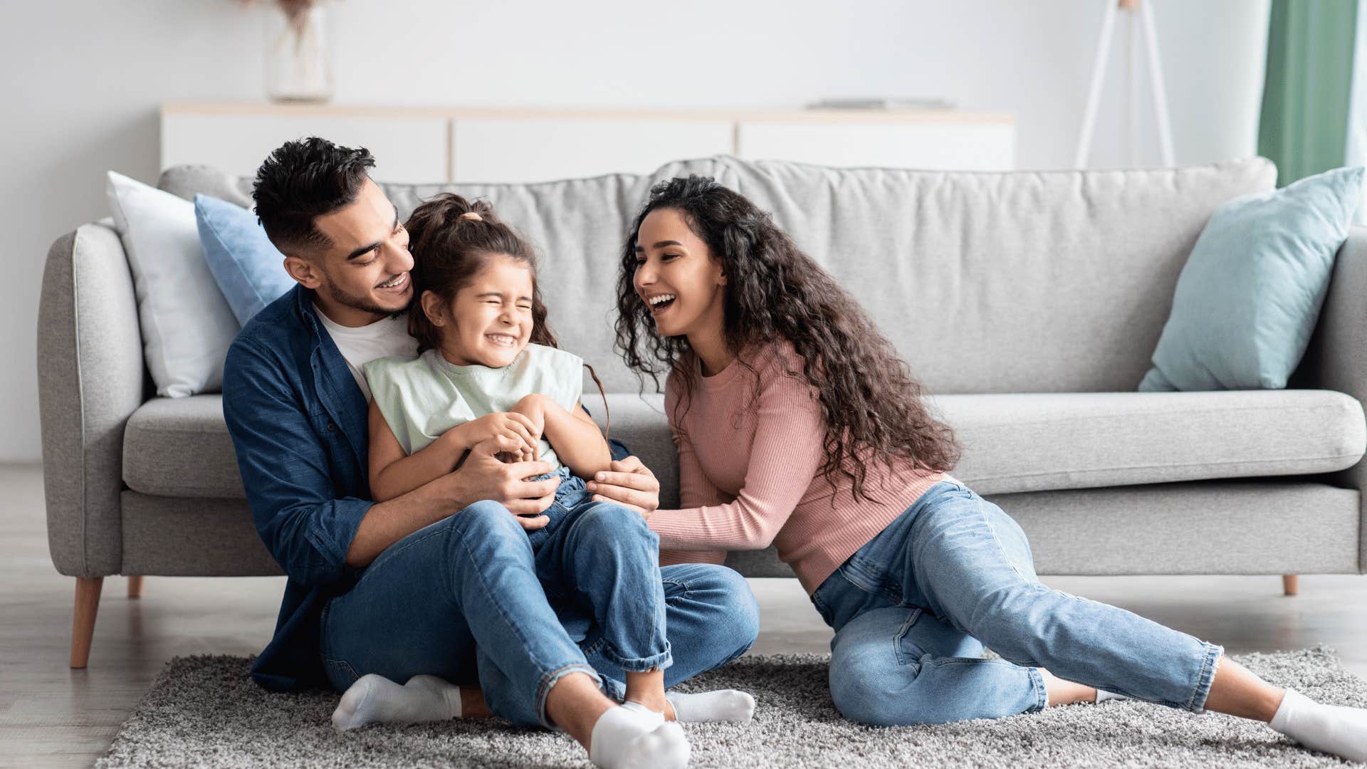 parents laughing with child