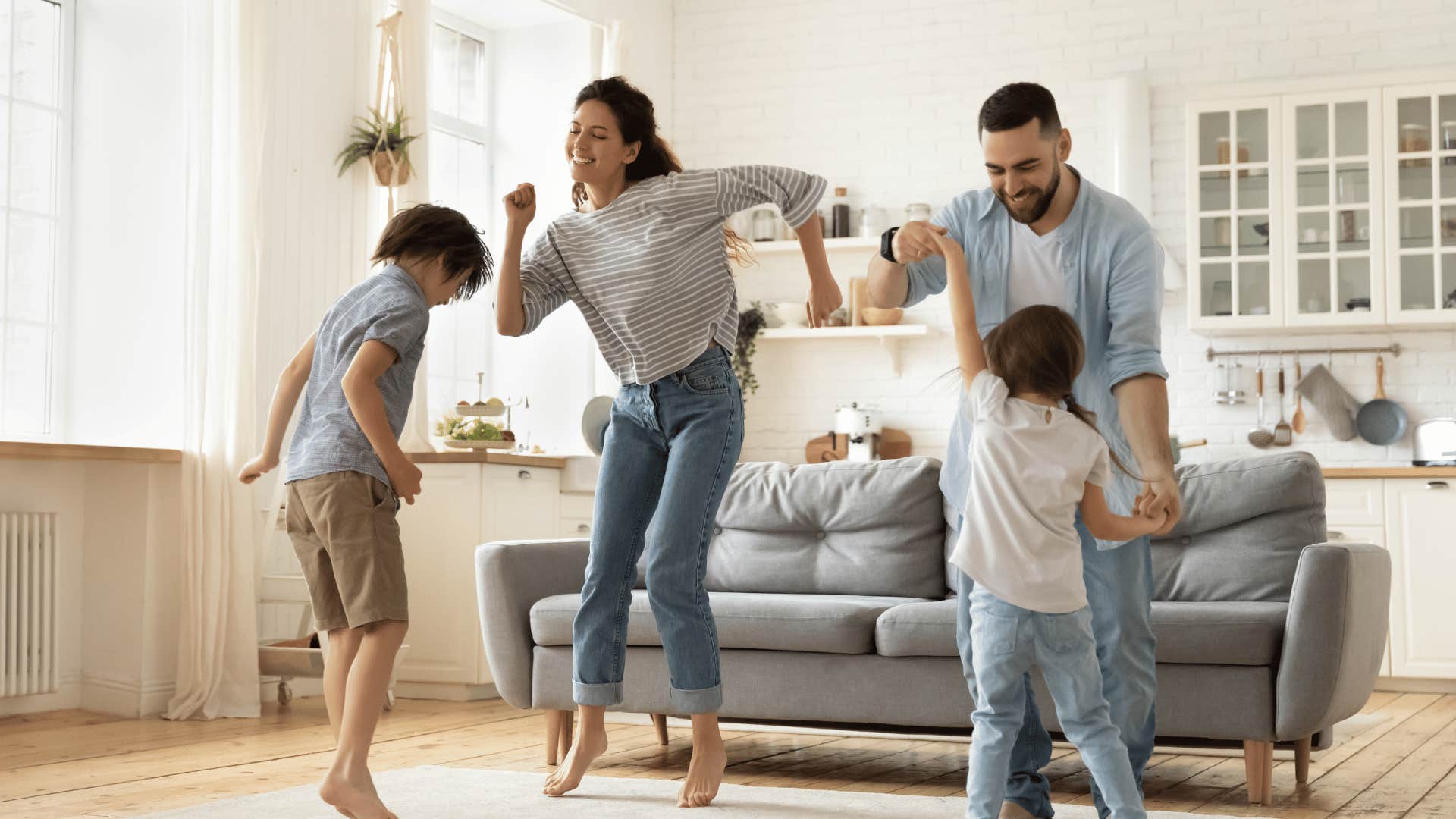 family dancing in living room