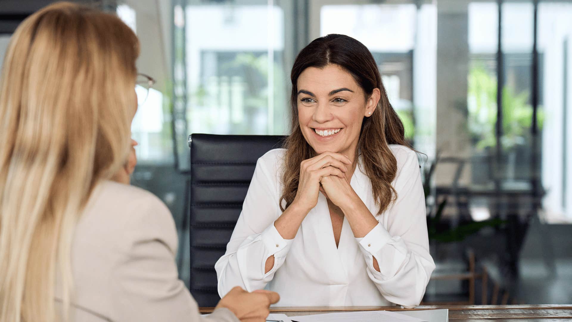 woman interviewing other woman