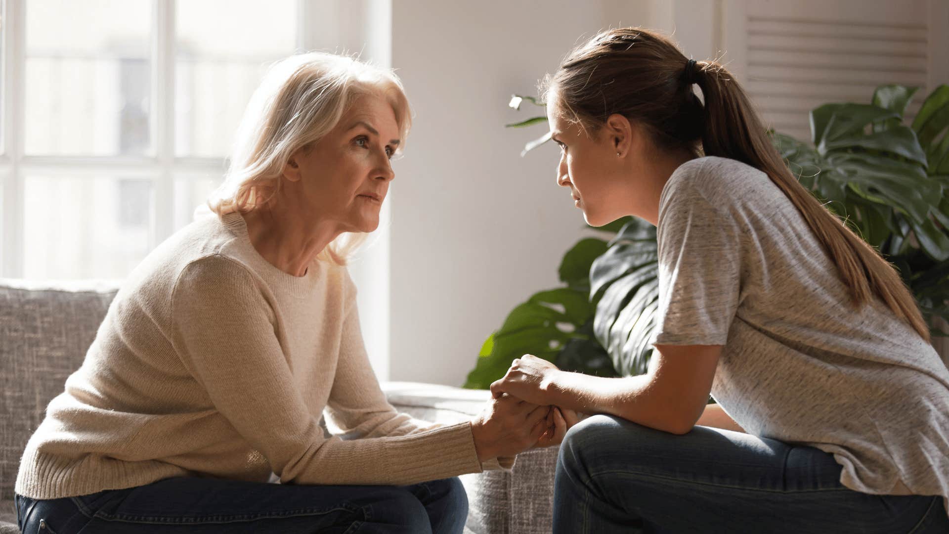 adult woman talking to her older mother