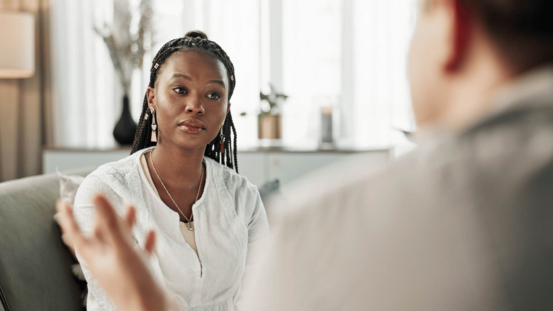 upset woman talking with man