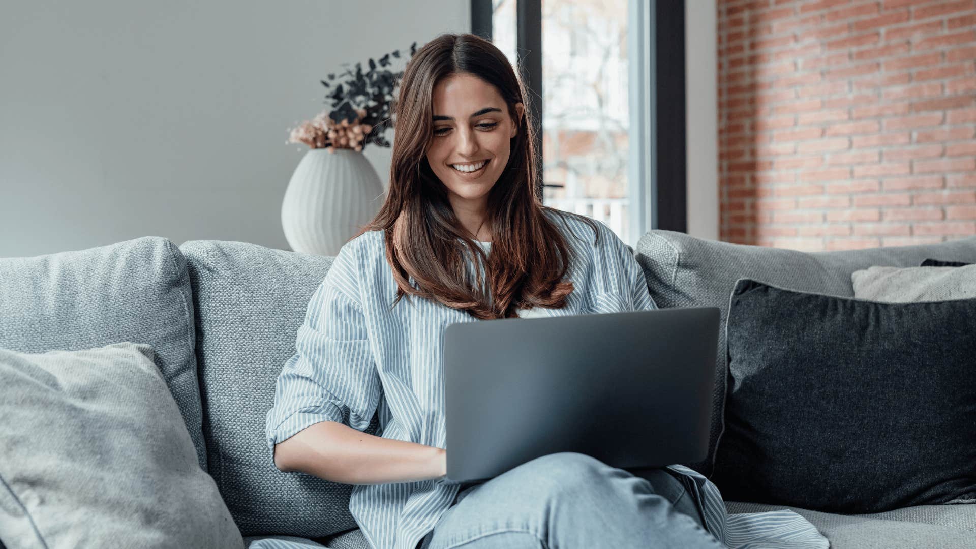 woman smiling on laptop