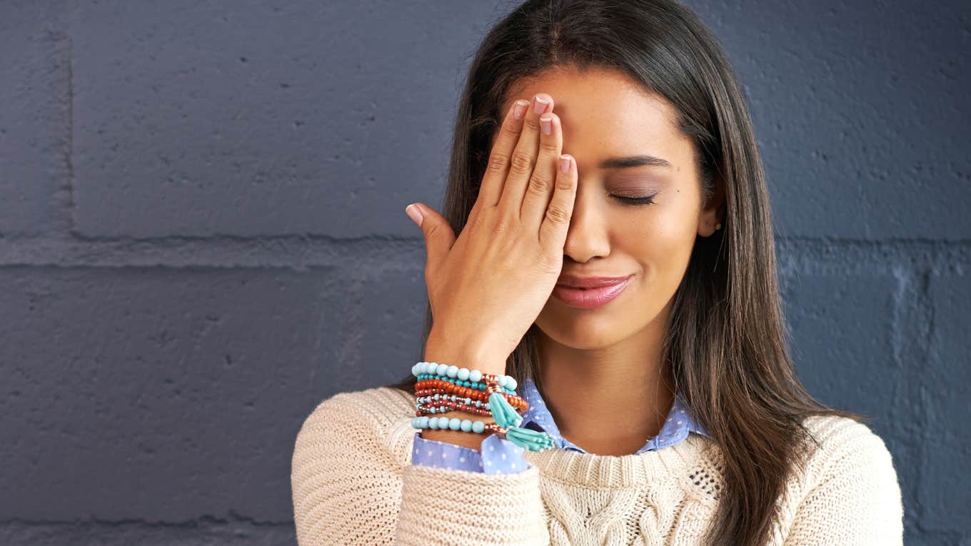 Woman embarrassed thinking about a word she mispronounced