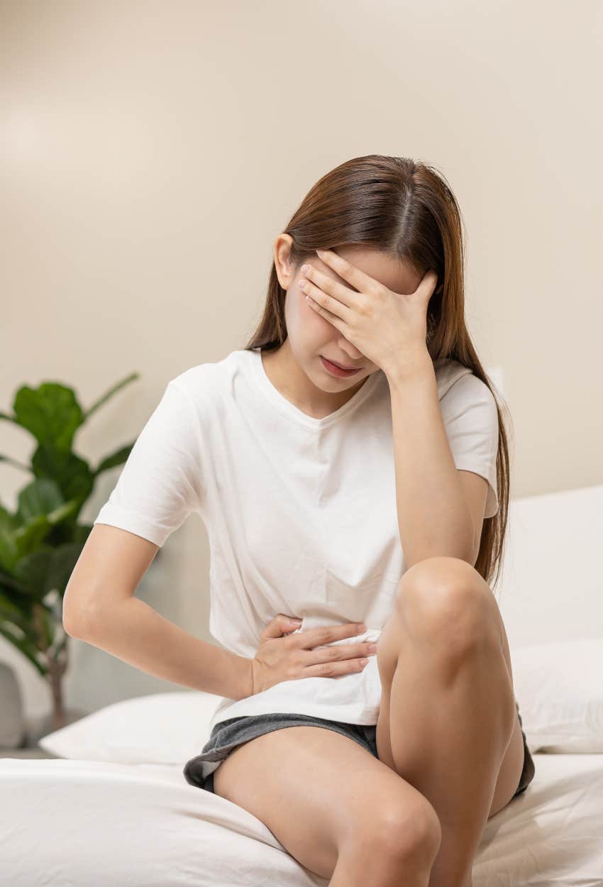 Woman with period cramps whose absence from work is unexcused