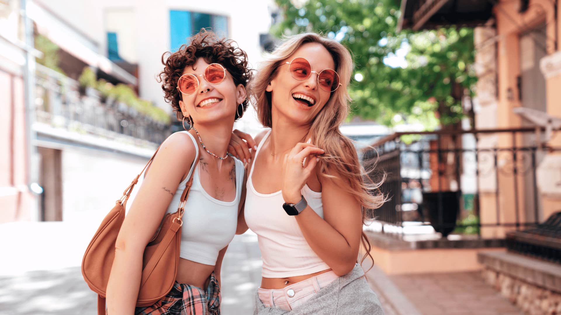 smiling female friends hugging each other