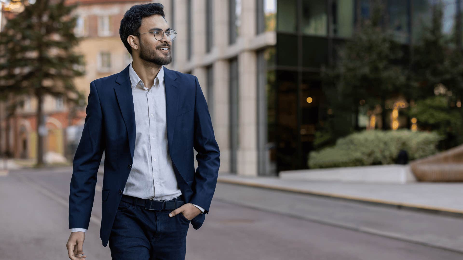 man in a suit walking down street