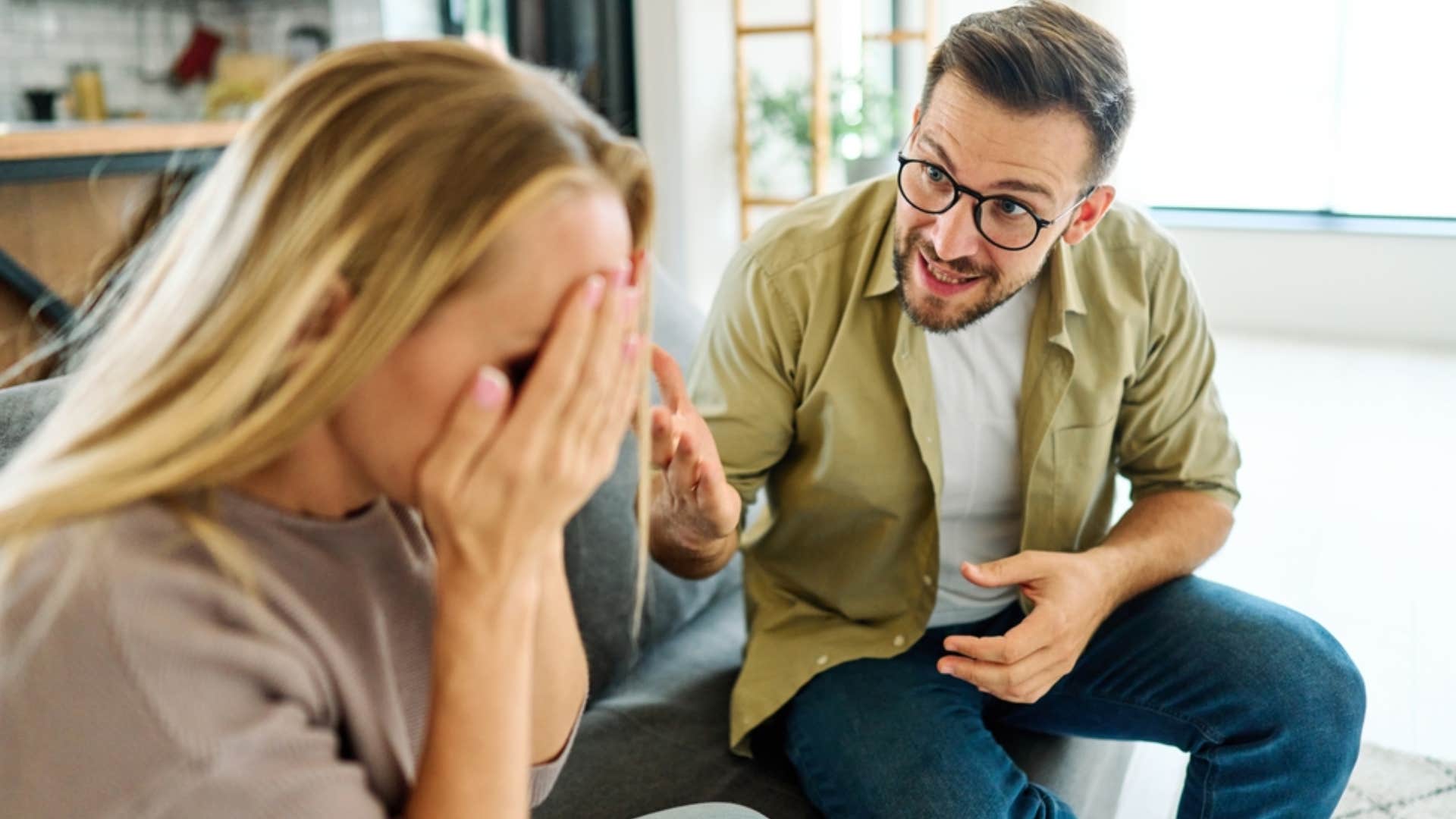 man asking woman to calm down