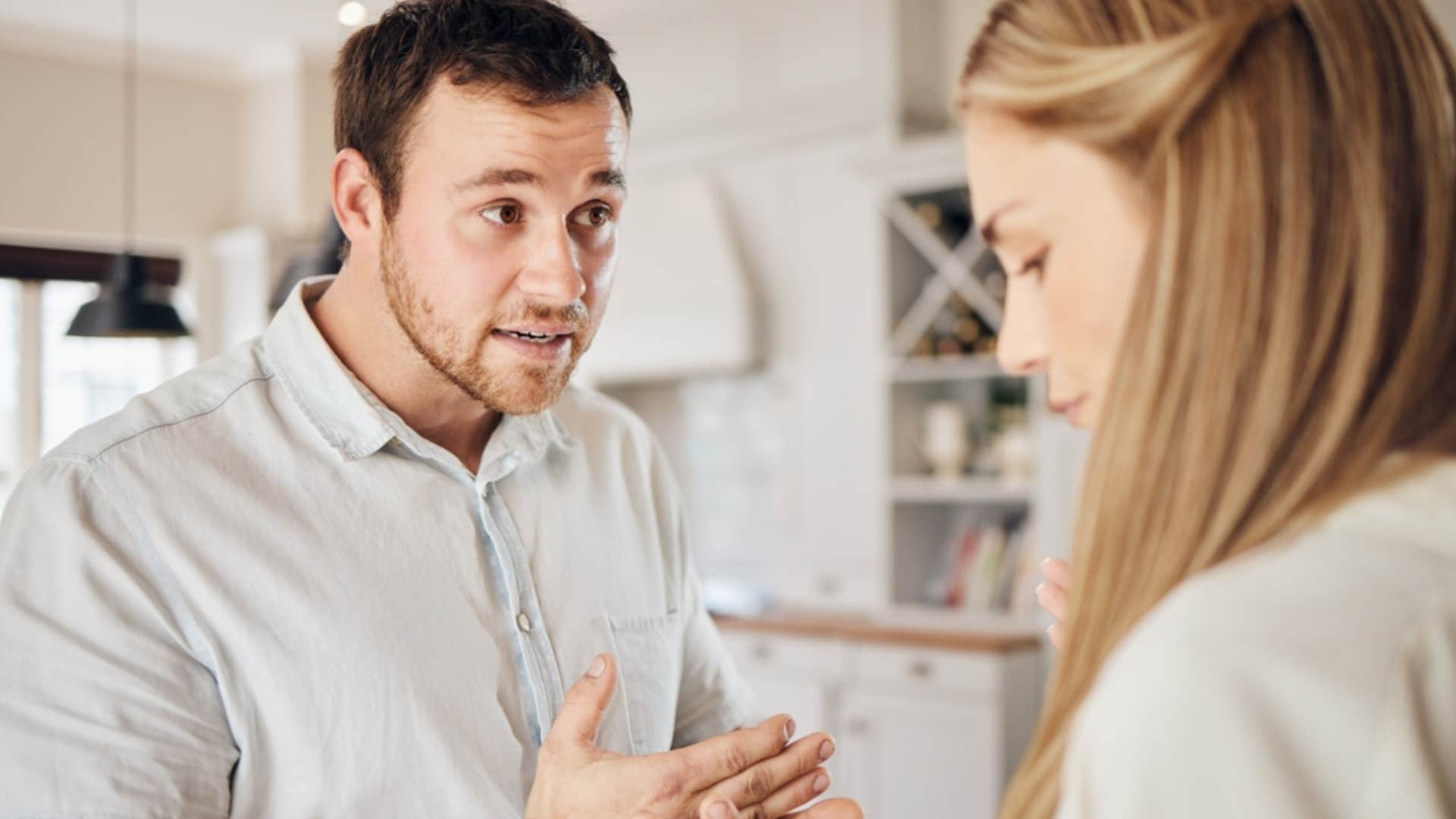 man explaining his feelings to woman