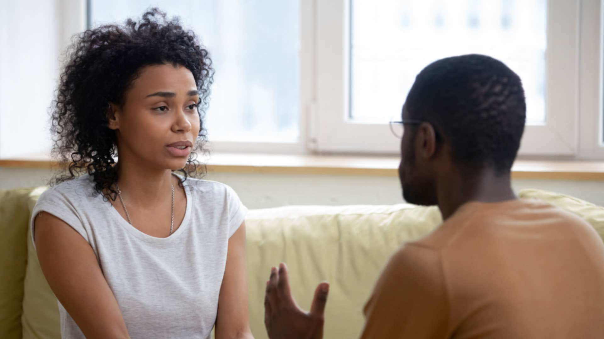 woman telling man he's unhelpful