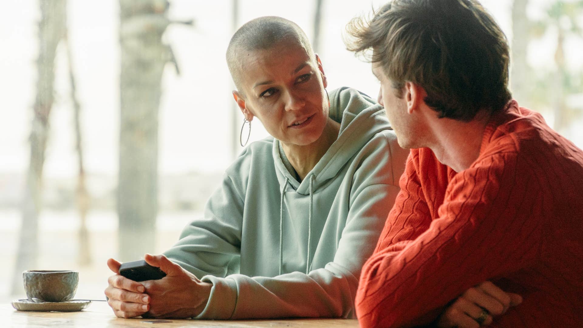 Woman having a serious conversation with her teenage son.