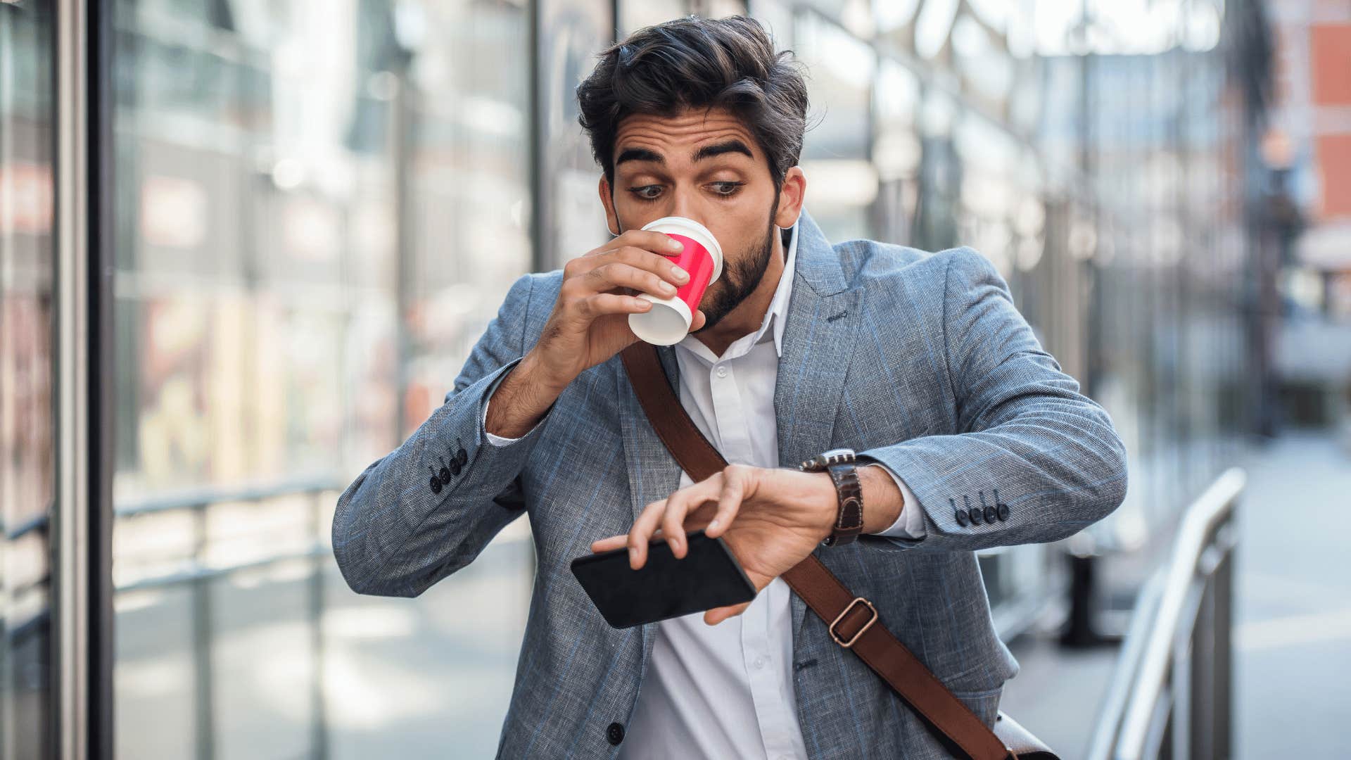 man in a hurry checking his watch