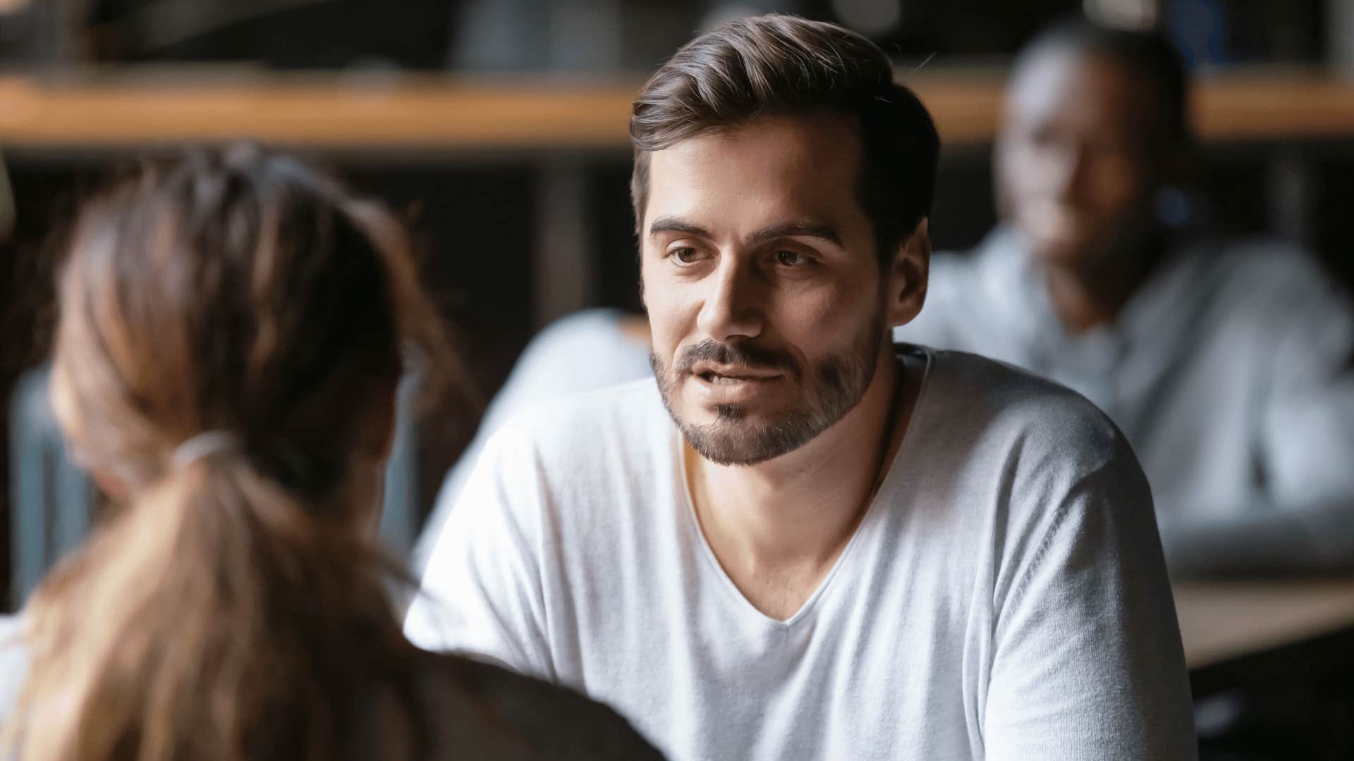 respected man talking to woman