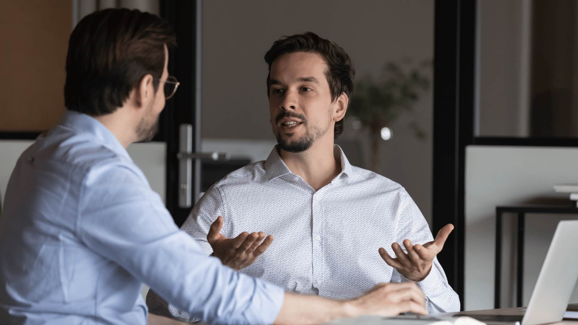 man boasting to colleague