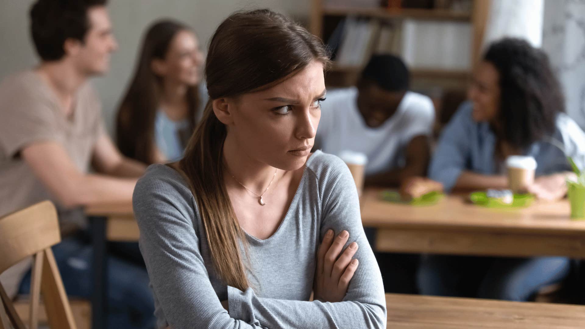 woman crossing arms looking upset