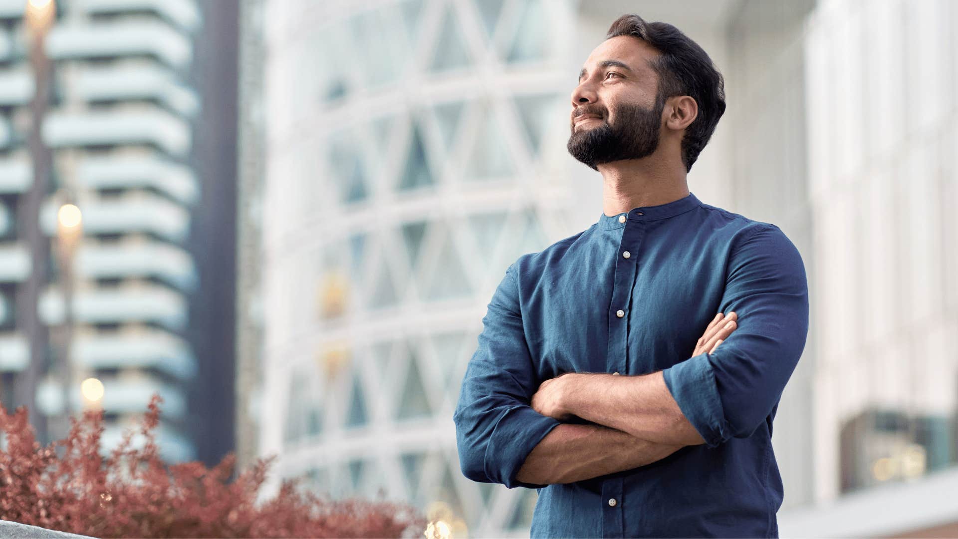 man crossing arms confidently 