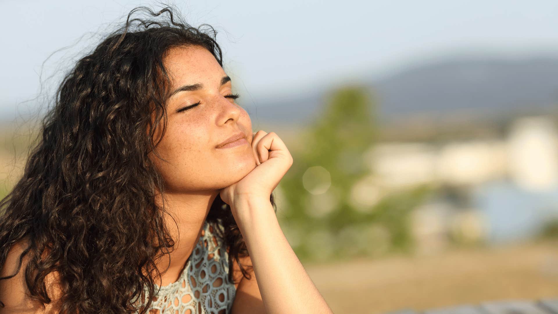 emotionally intelligent woman smiling and thinking