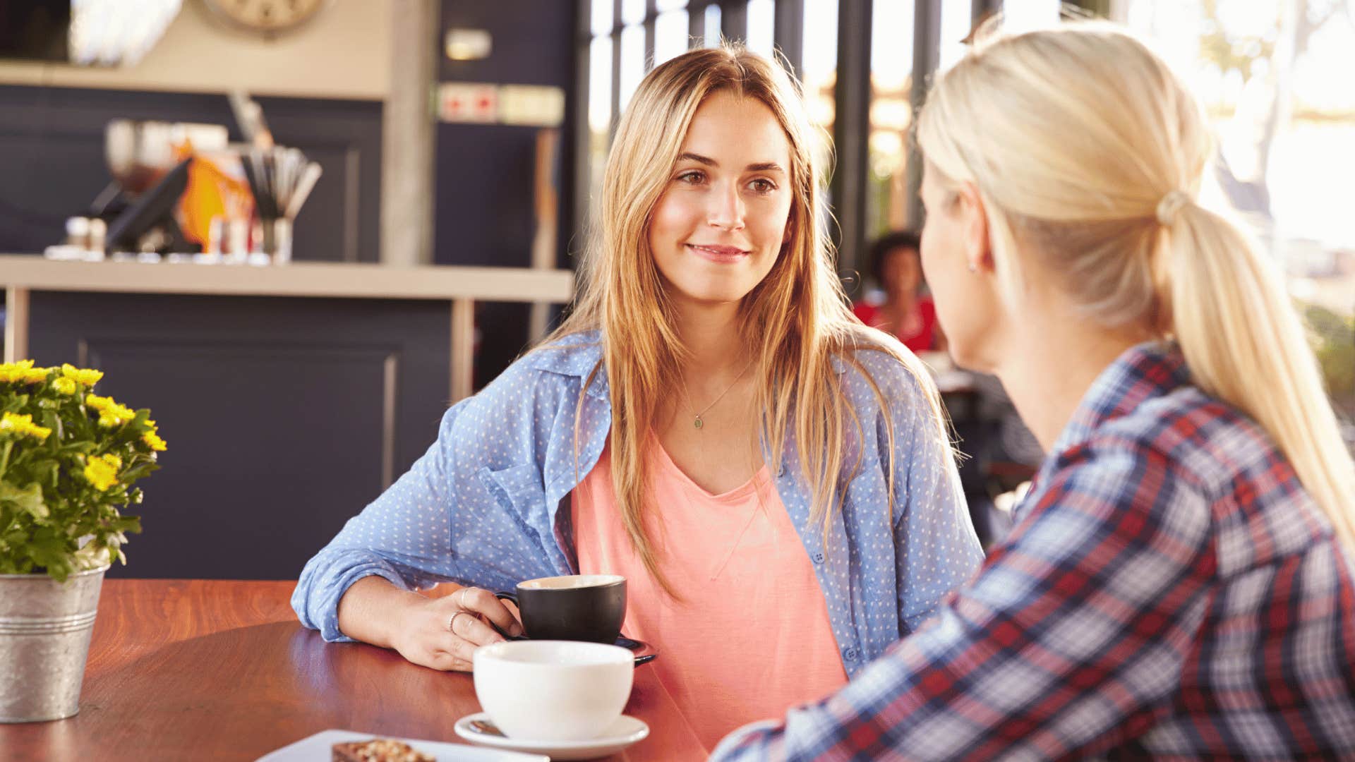 two women listening and talking