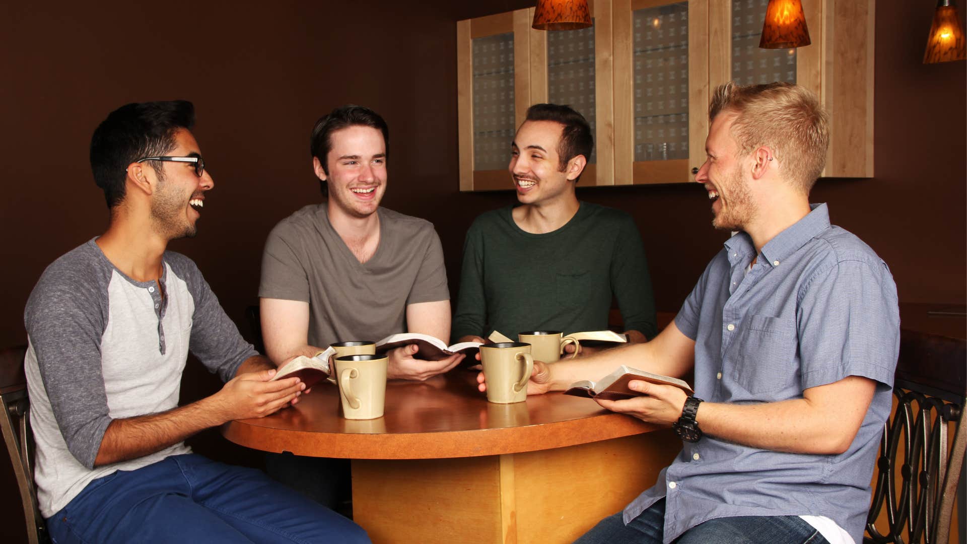 Three men introducing one man to the group