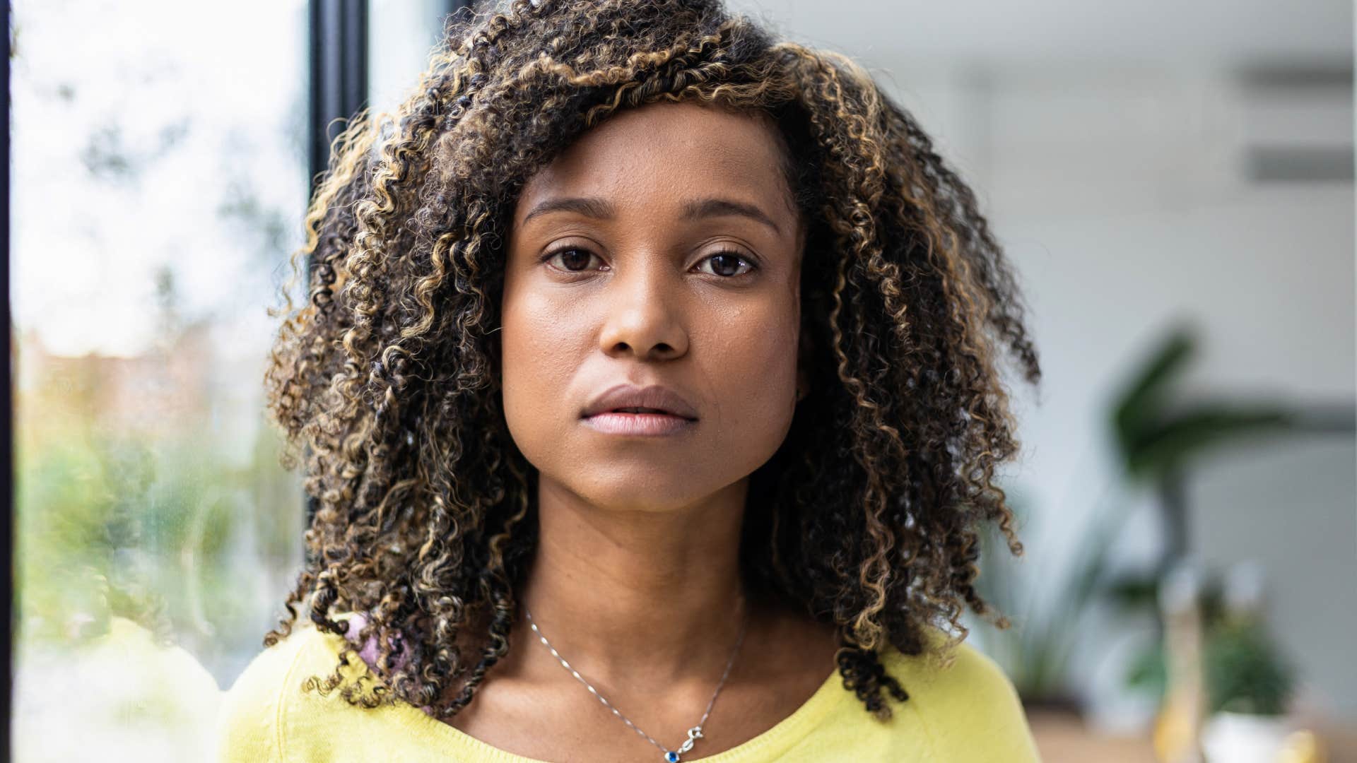 secretly controlling woman looking straight ahead