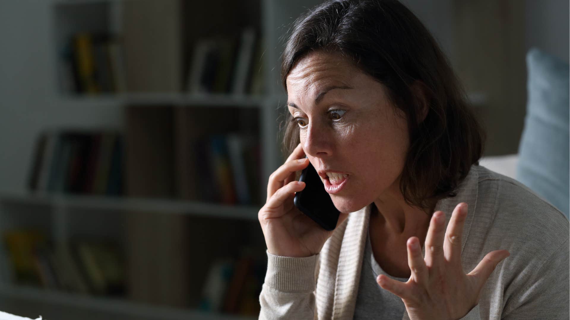 woman arguing with someone on the phone