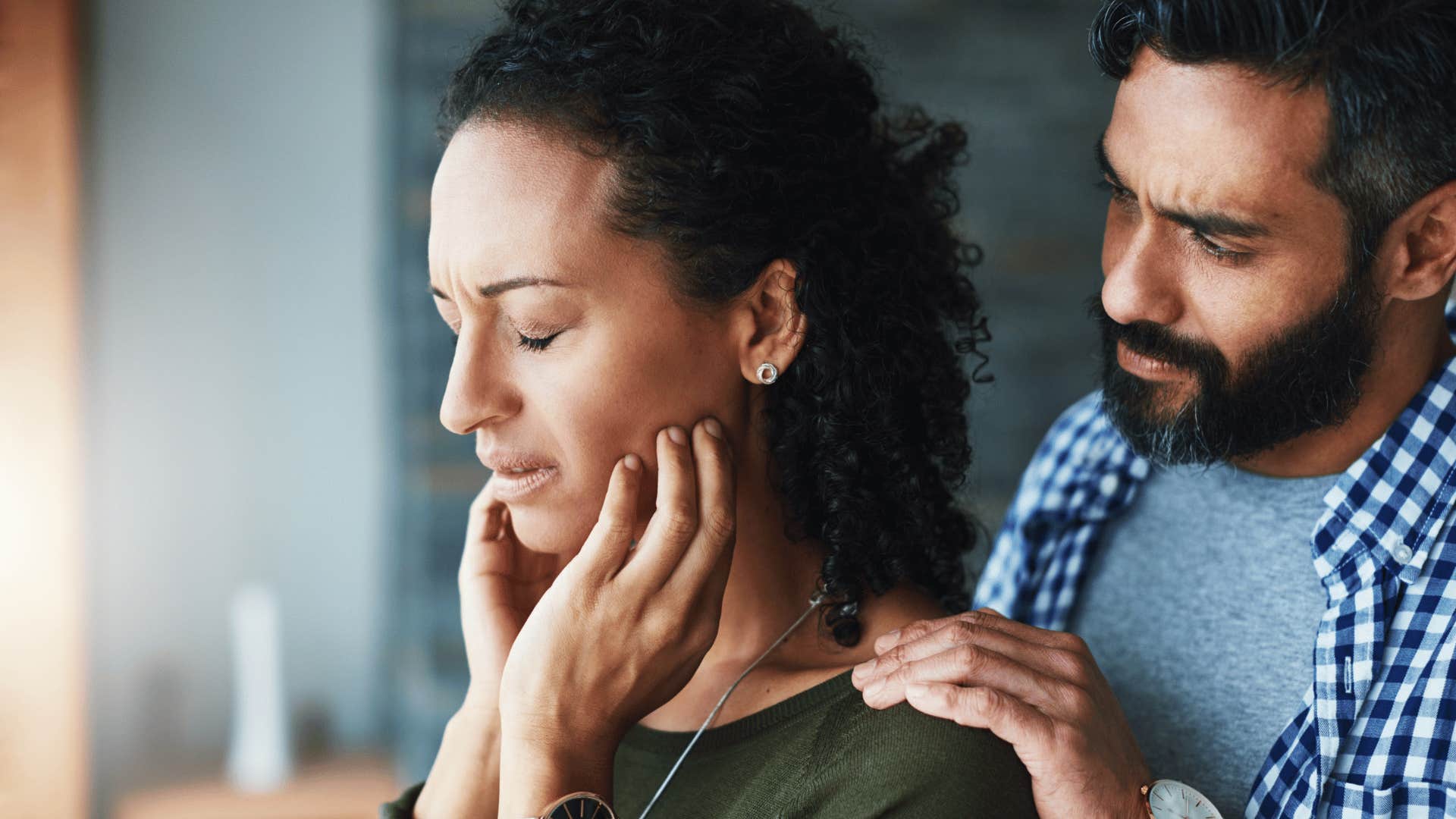 worried woman with man comforting her