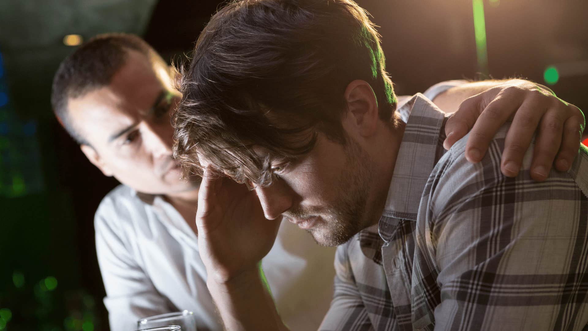 upset man with his hand on his head