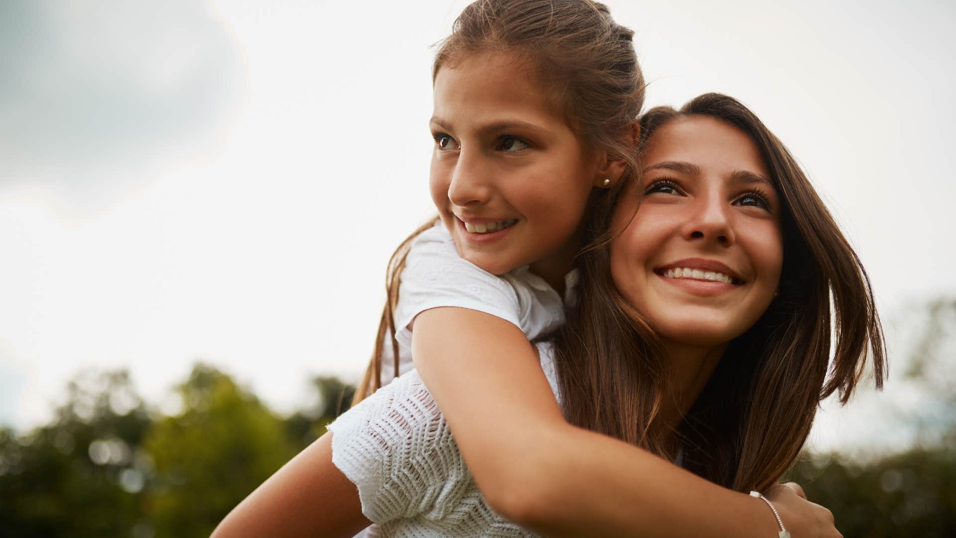 mother carries daughter on her back after stating she is lazy