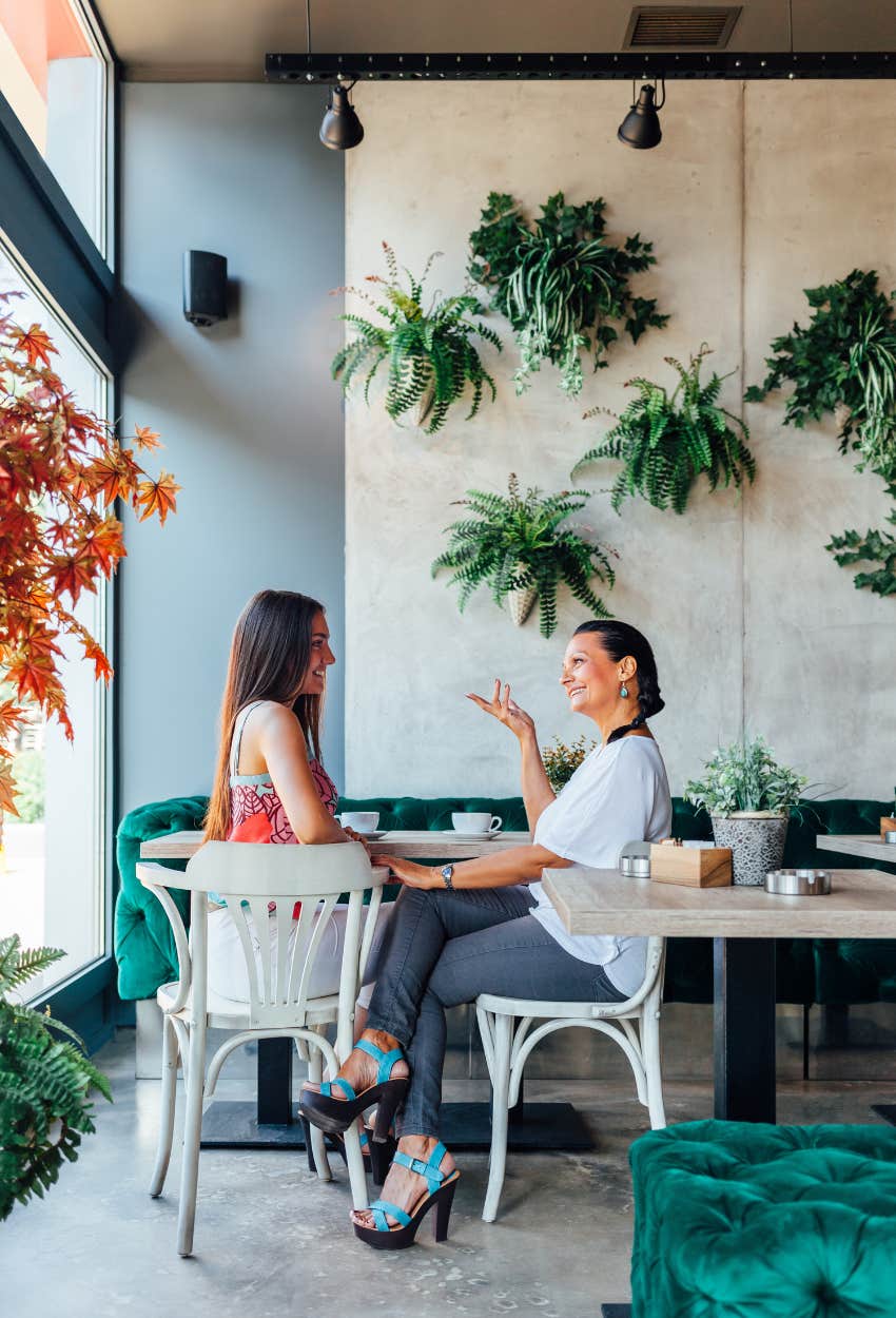 two women talking during a business lunch meeting