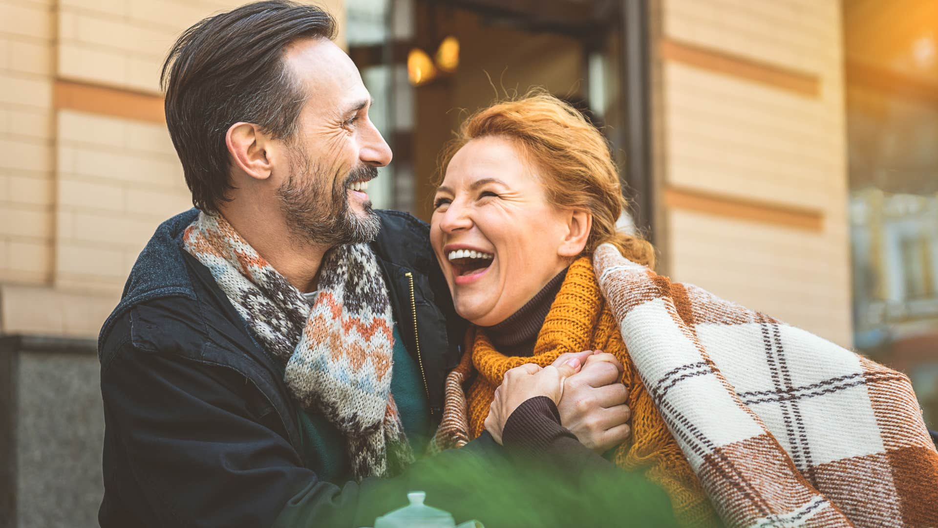 couple smiling and being free with each other