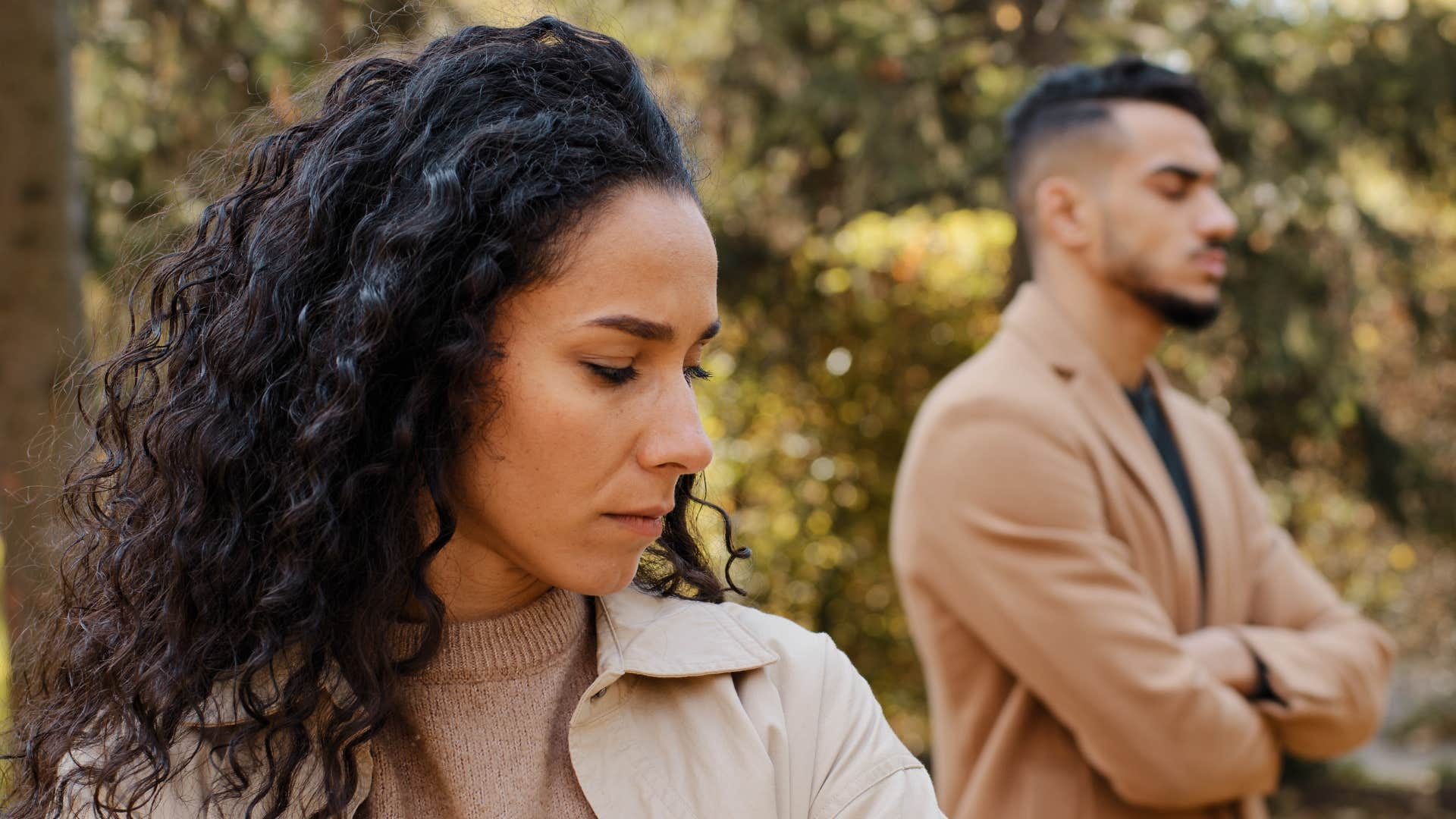 man avoiding being affectionate with wife