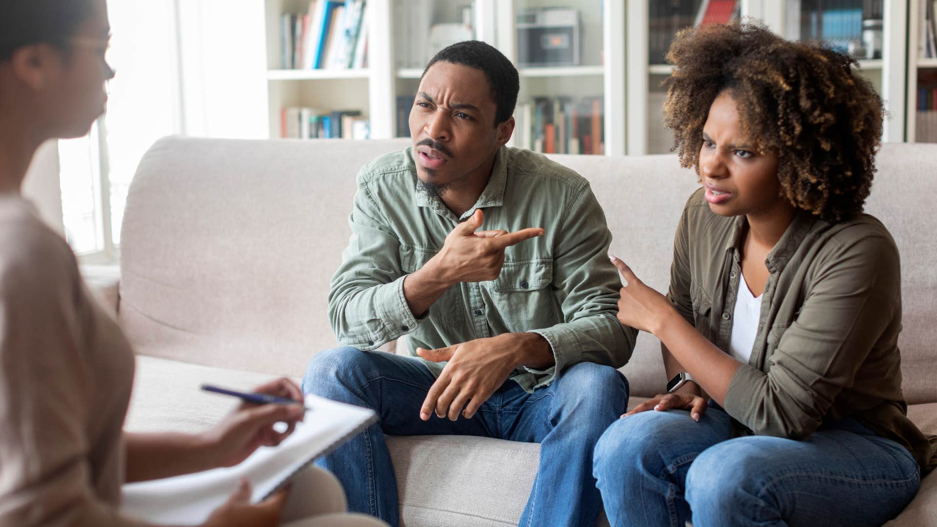 man blaming wife in front of therapist