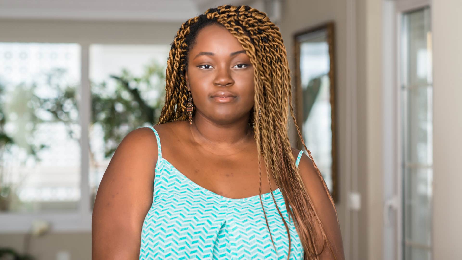 woman at home with serious expression