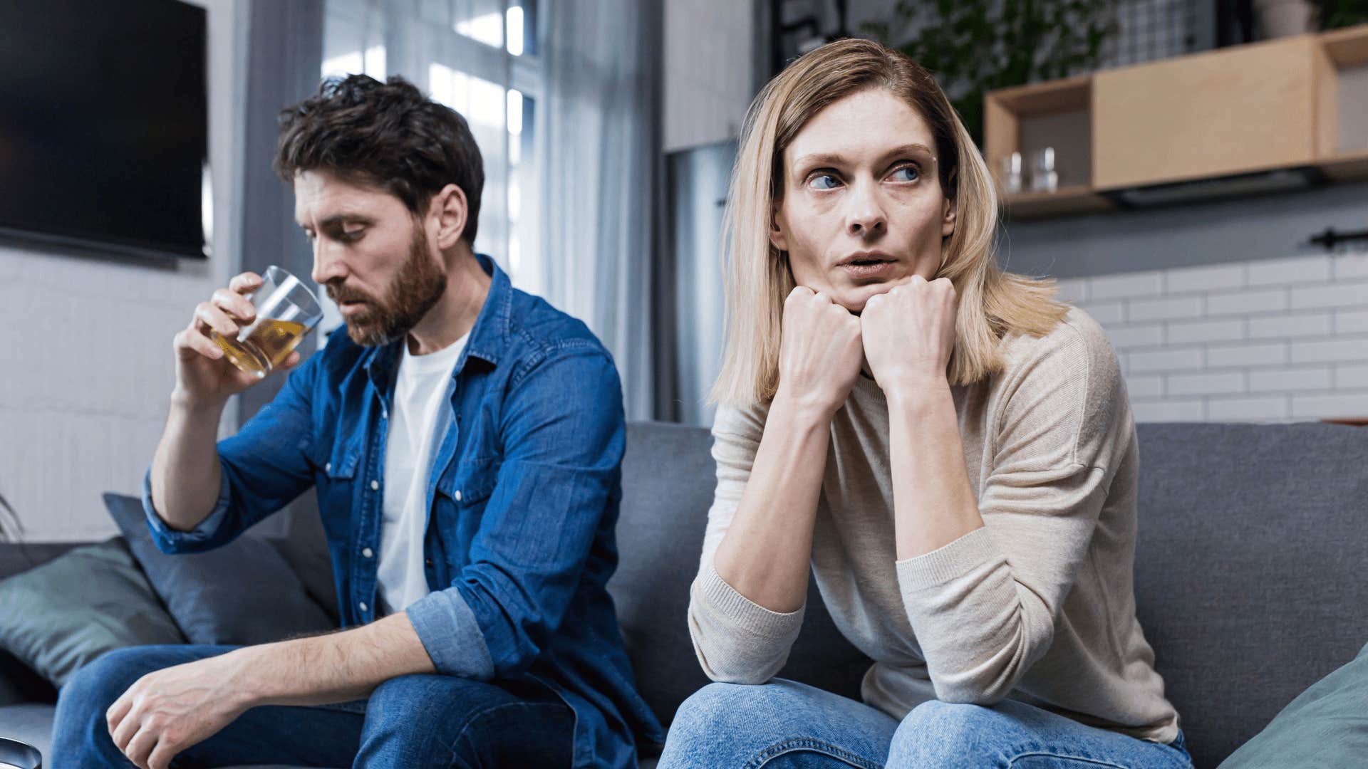 emotionally withdrawn wife sitting next to husband