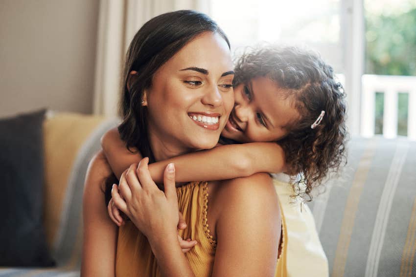 child hugging mother