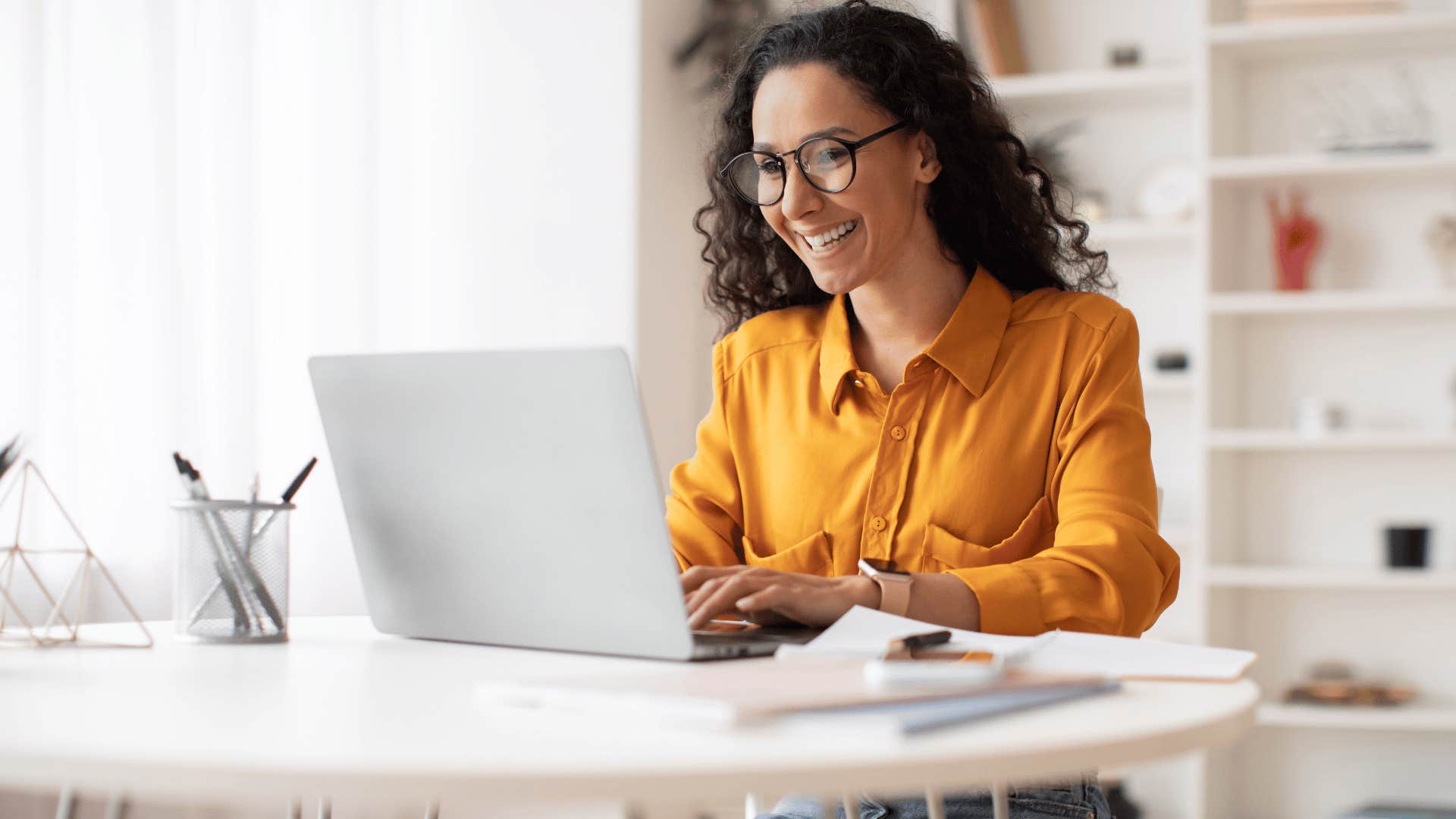 woman smiling on laptop