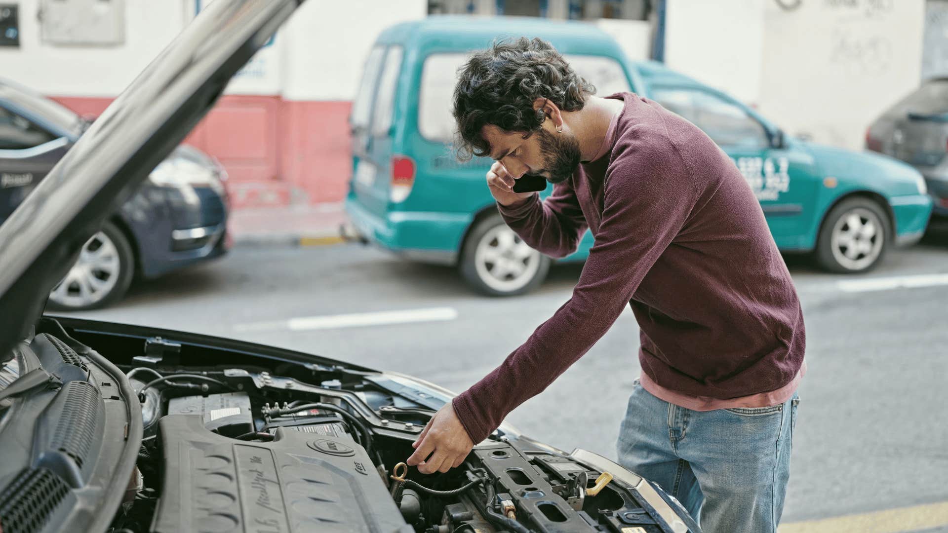 Gen Z man fixing car