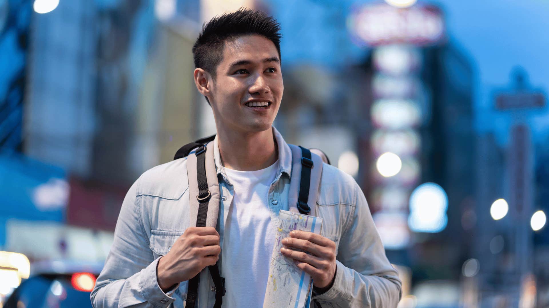 Gen Z man traveling by himself in the city