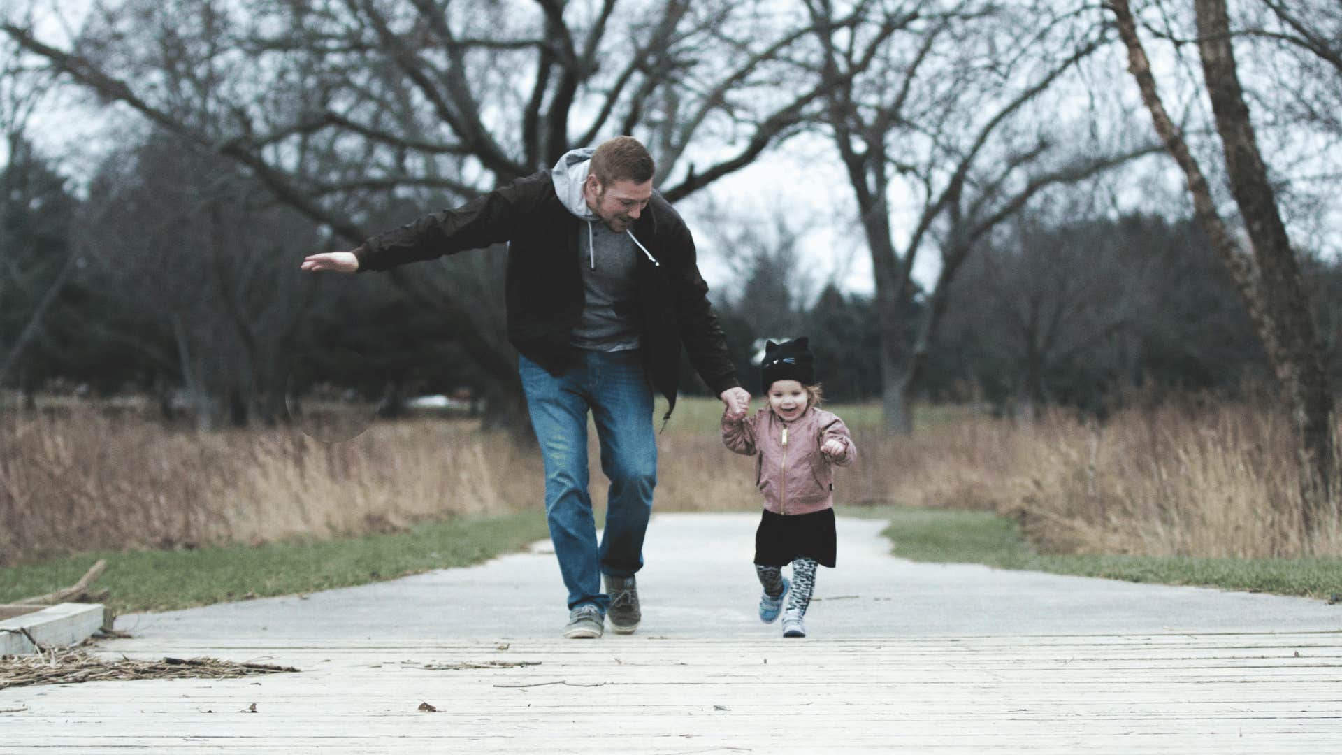 man walking with his child