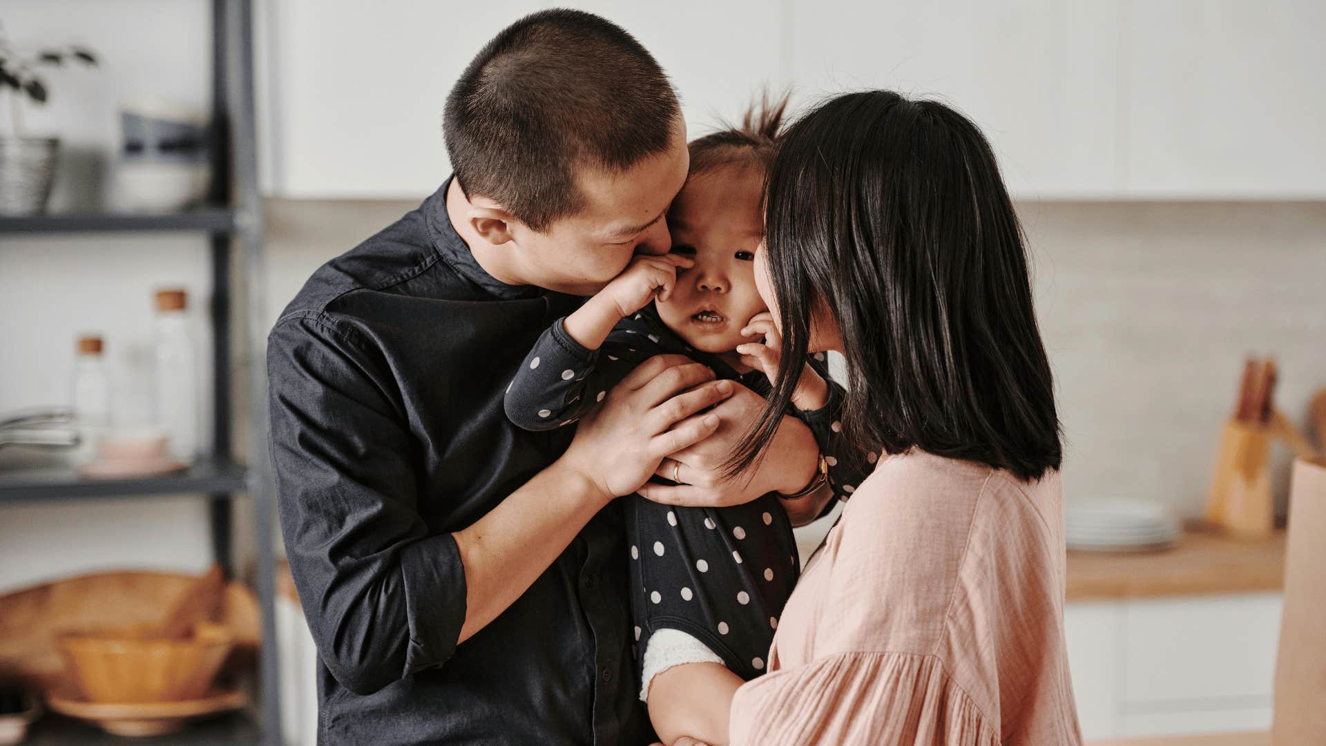 parents soothing crying child