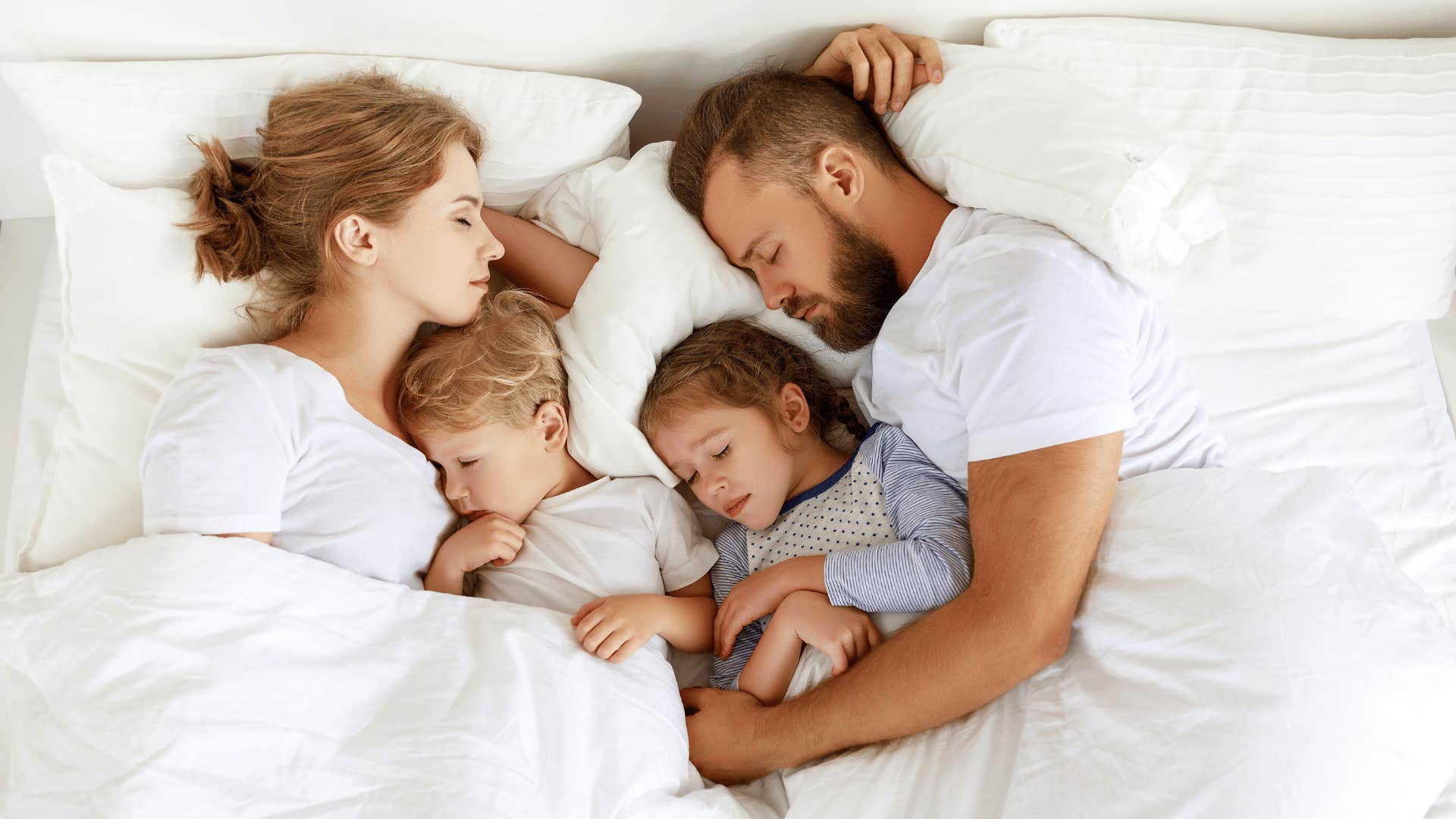 couple in bed with kids