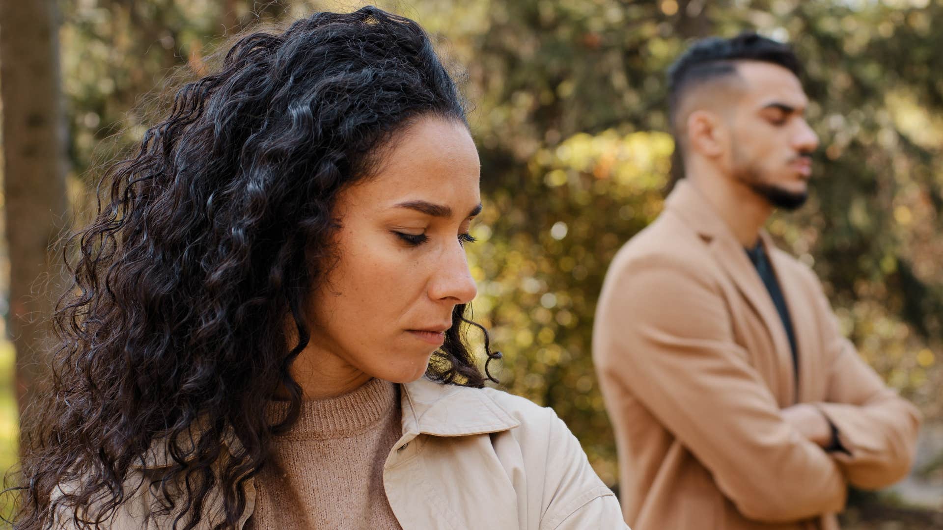 emotionally distant woman looking away from husband