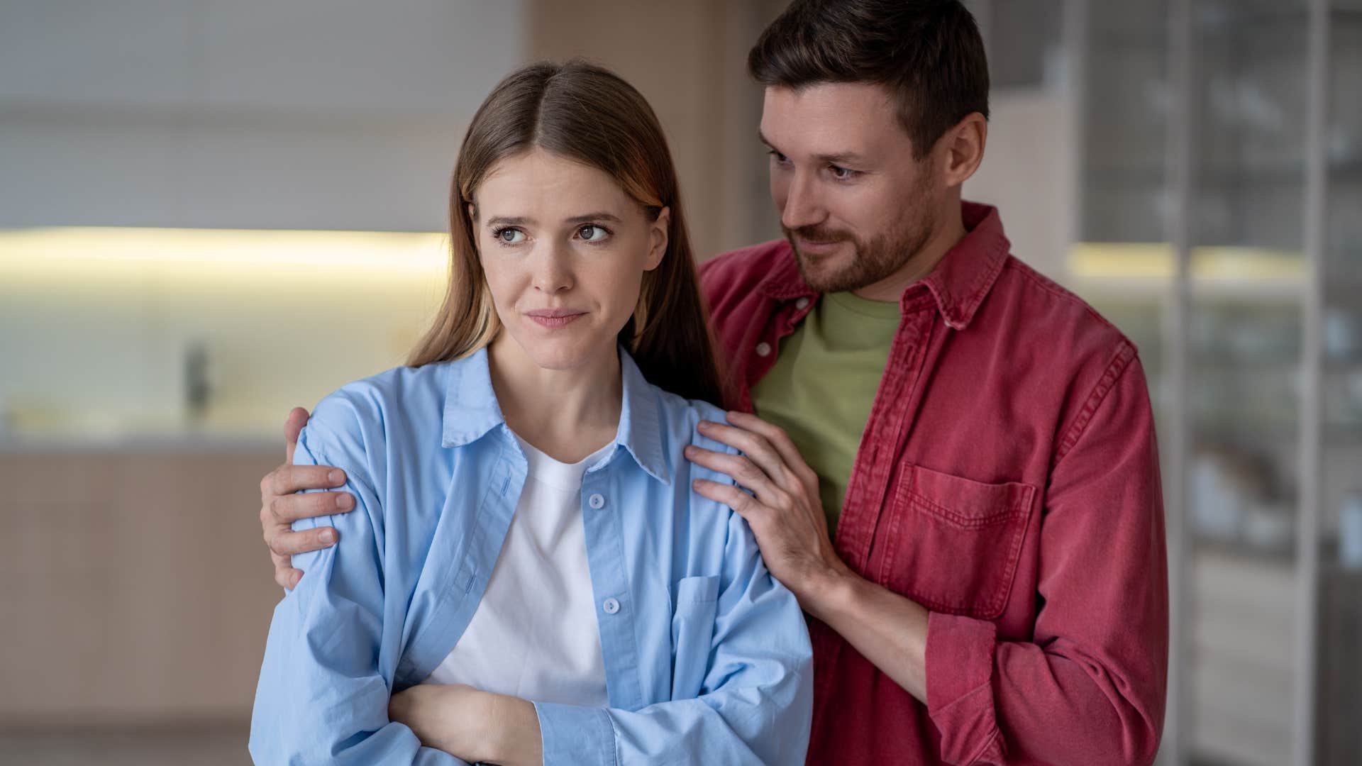 annoyed woman turned away from her husband