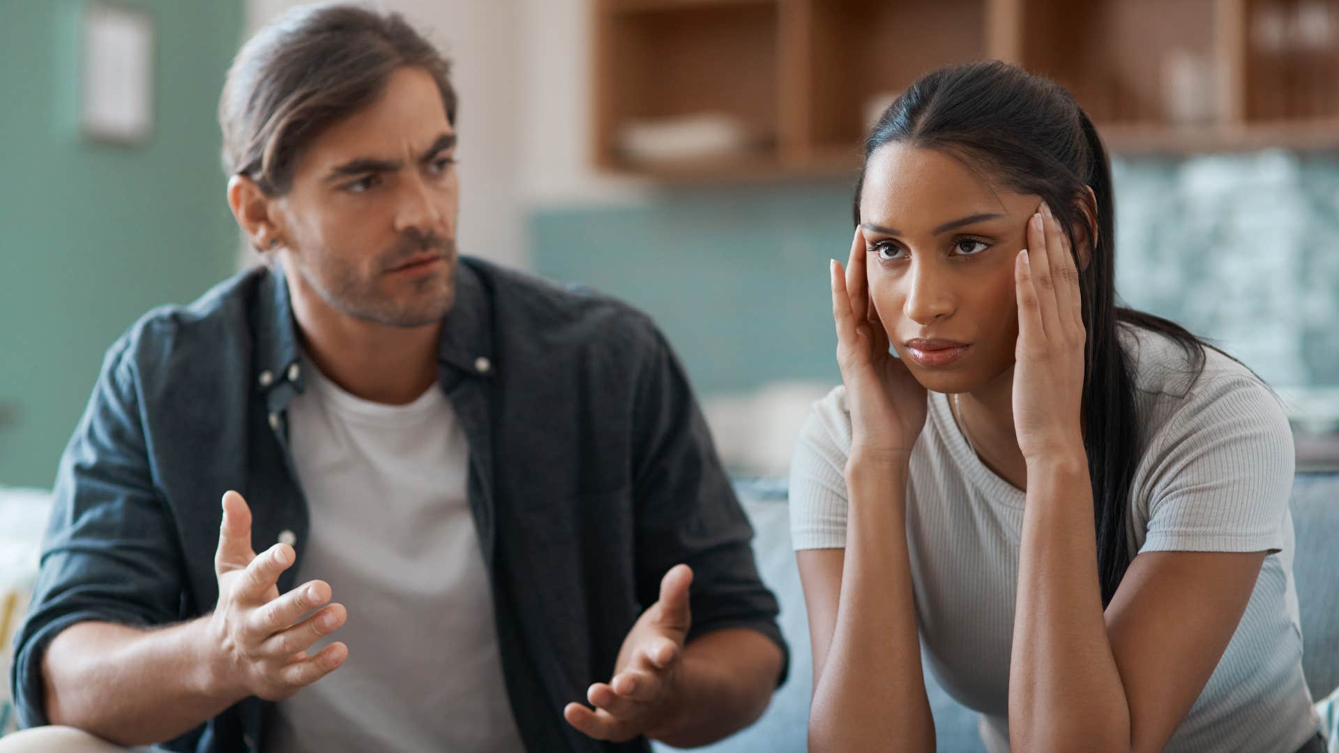 annoyed woman being confronted by husband