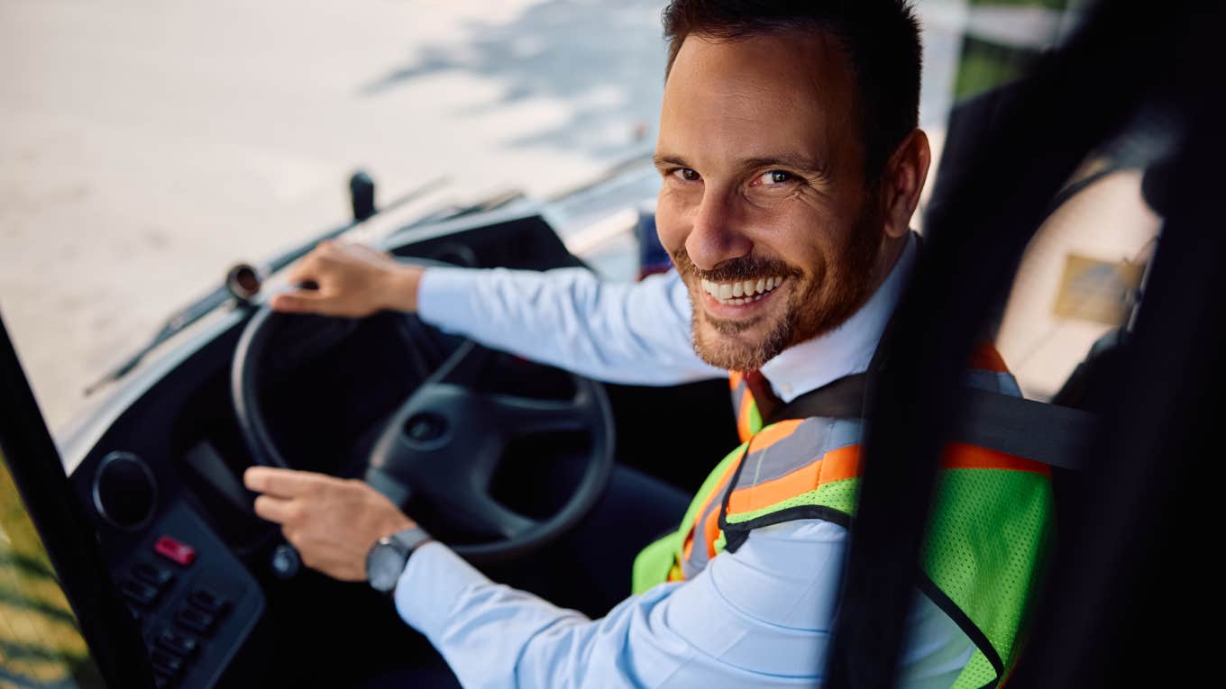 school bus driver smiling at camera