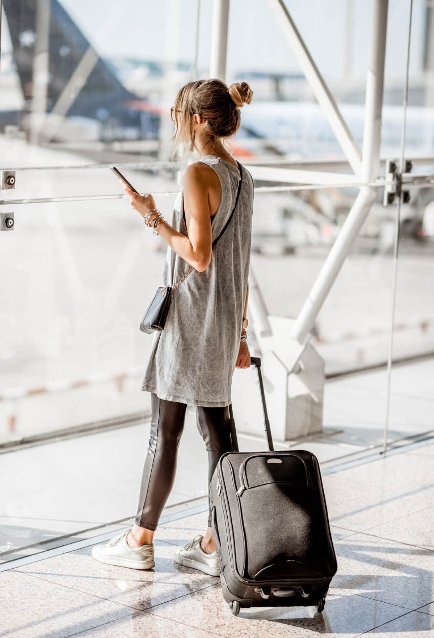 Woman in airport disabling auto connect to Wi-Fi to protect her sensitive info